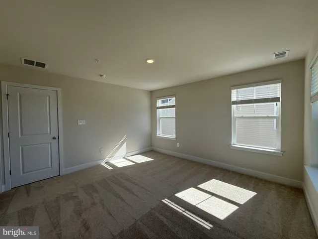 wooden floor and window in an empty room