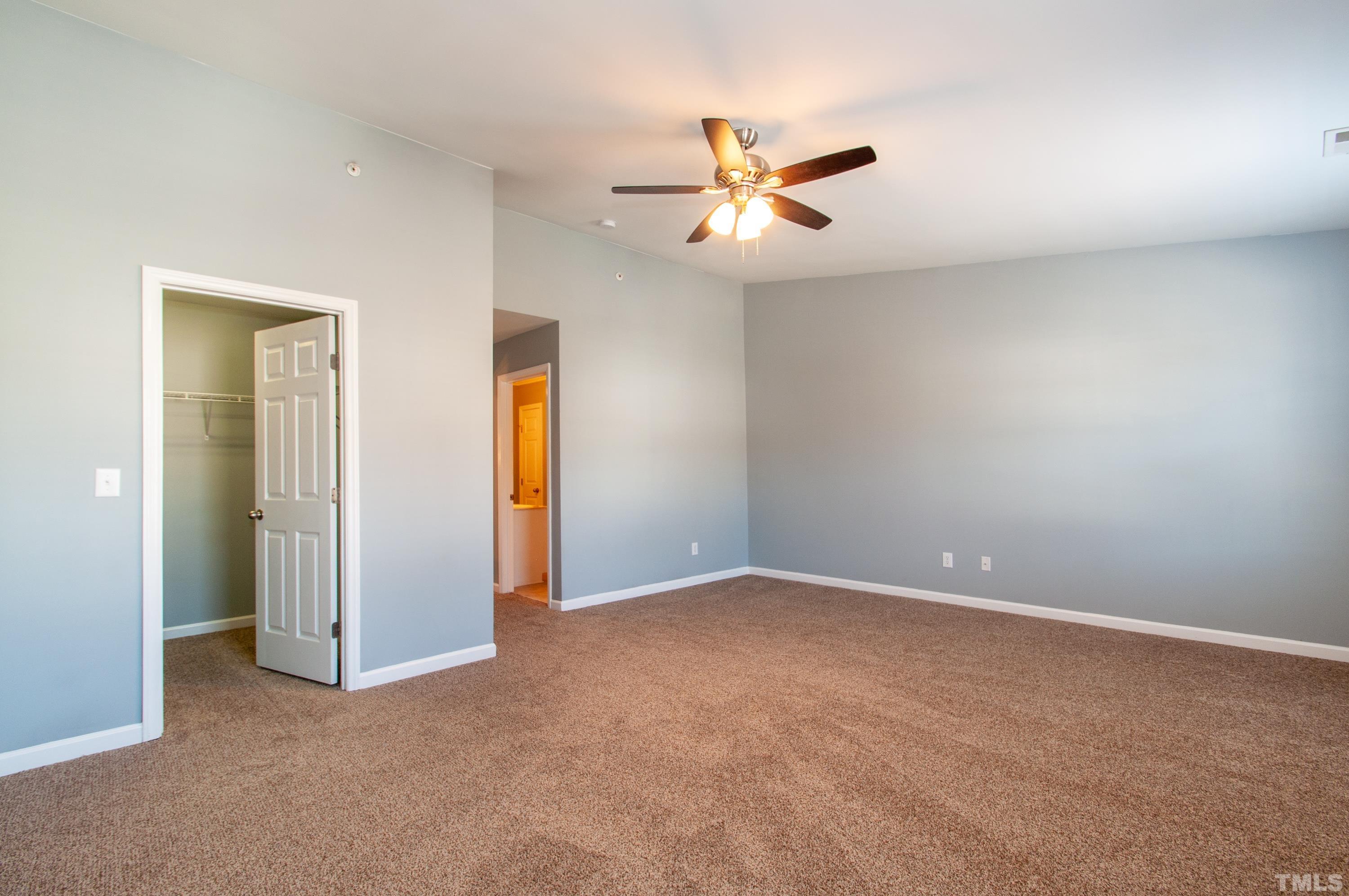 2210 Raven Road, Unit 102 Raleigh, NC 27614 - Photo 12 of 33 an empty room with windows and fan