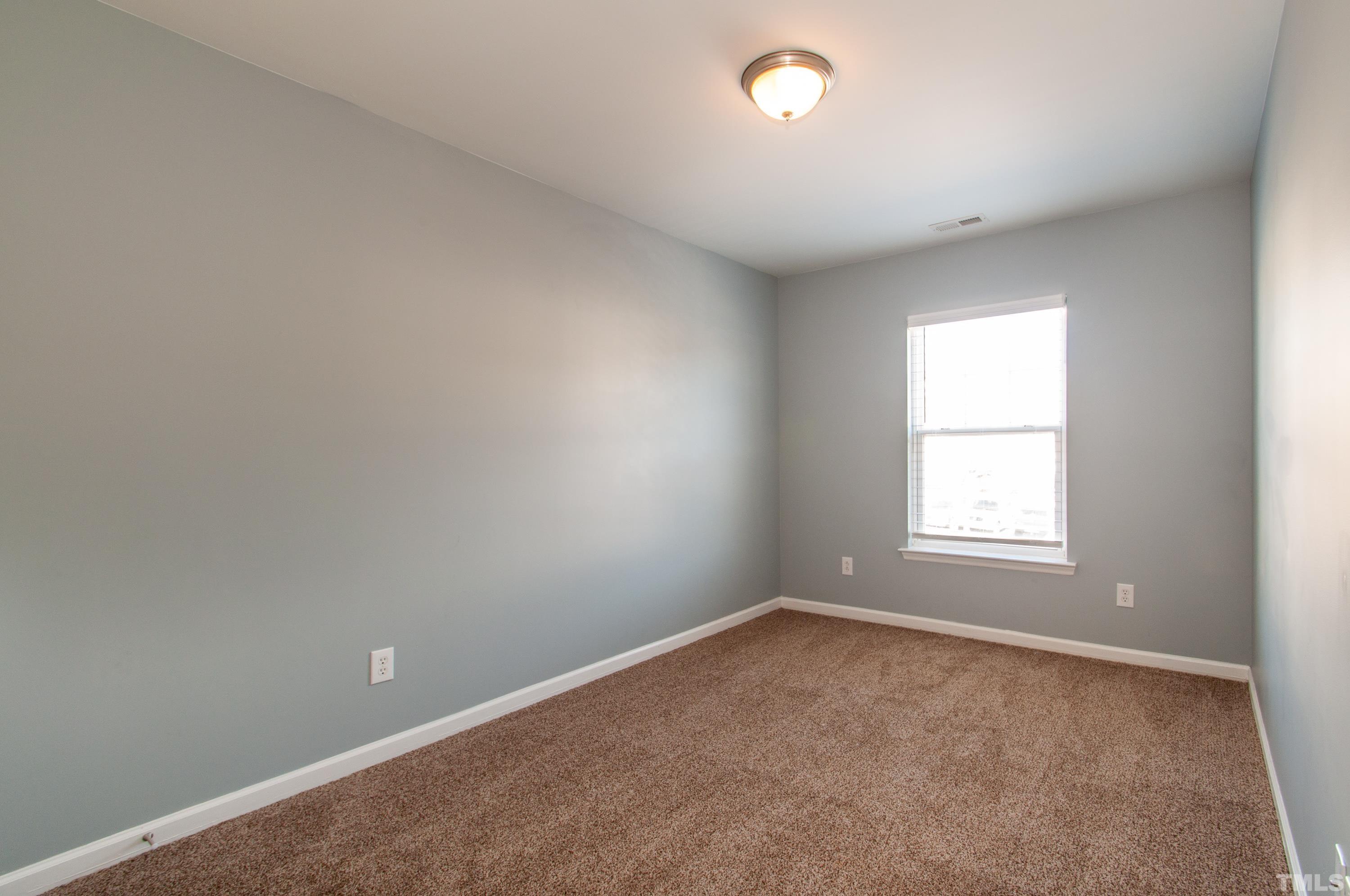 2210 Raven Road, Unit 102 Raleigh, NC 27614 - Photo 18 of 33 an empty room with a window