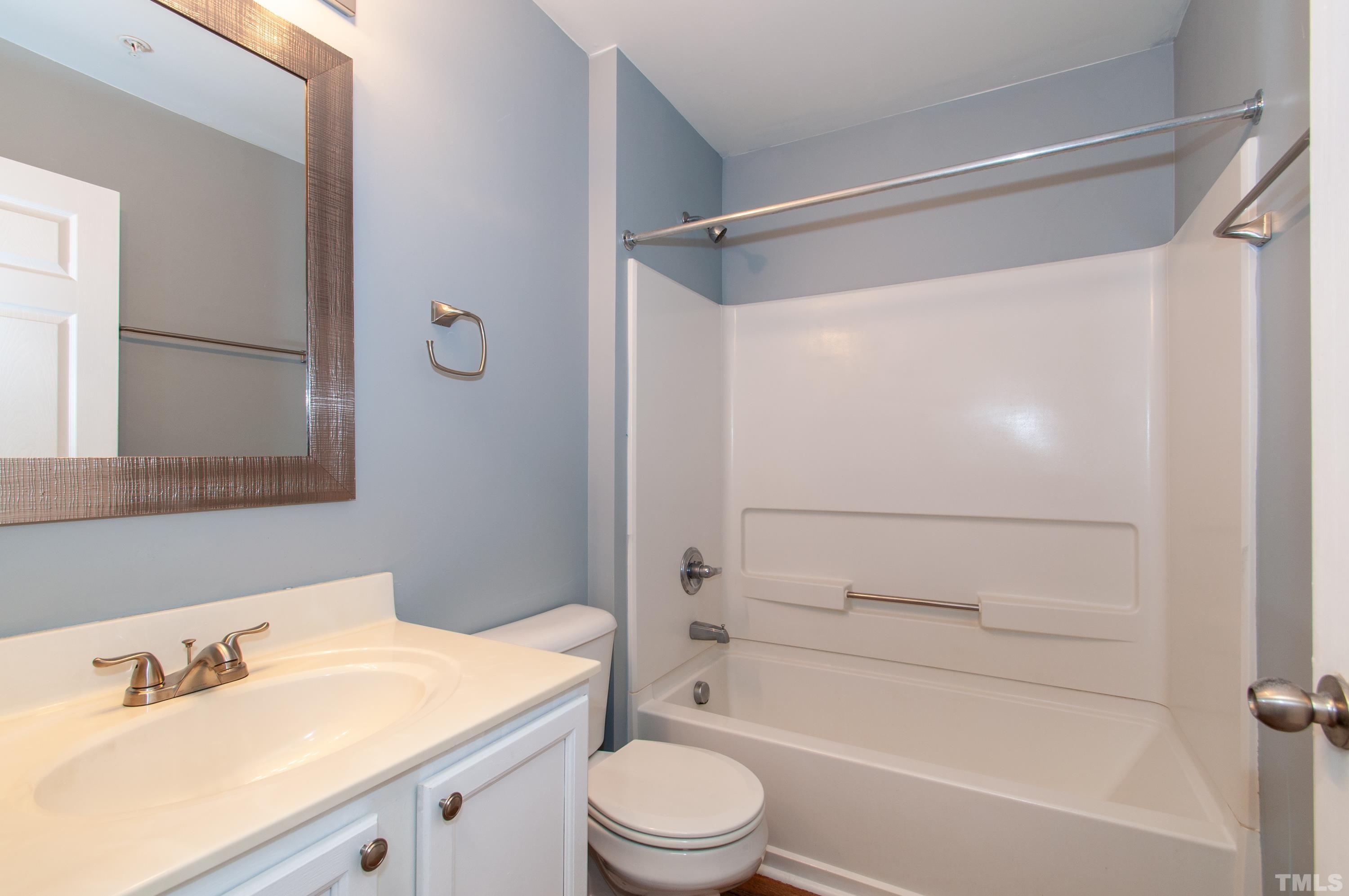 2210 Raven Road, Unit 102 Raleigh, NC 27614 - Photo 20 of 33 a bathroom with a sink toilet and shower