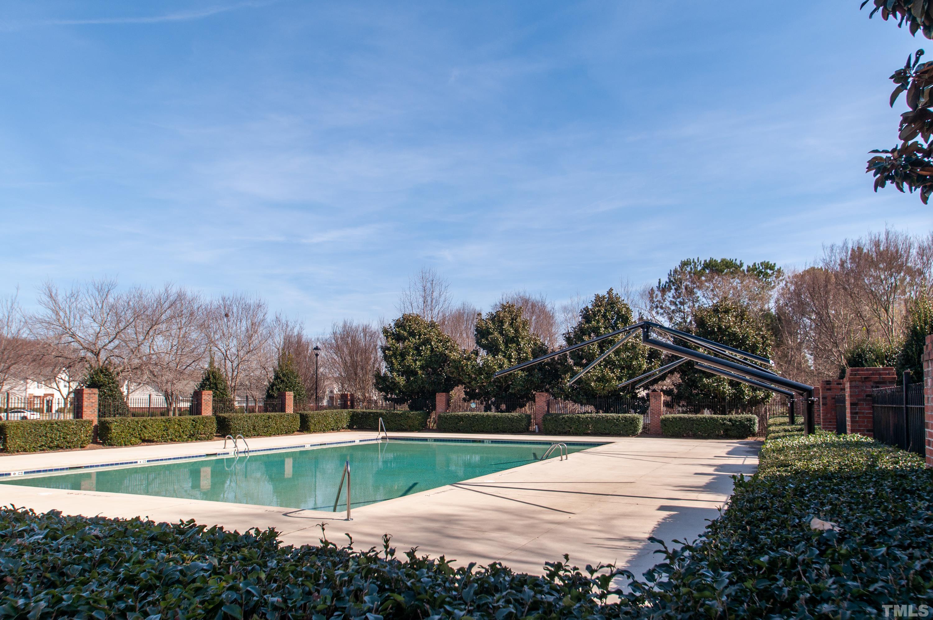 2210 Raven Road, Unit 102 Raleigh, NC 27614 - Photo 23 of 33 a view of a swimming pool and trees in the background