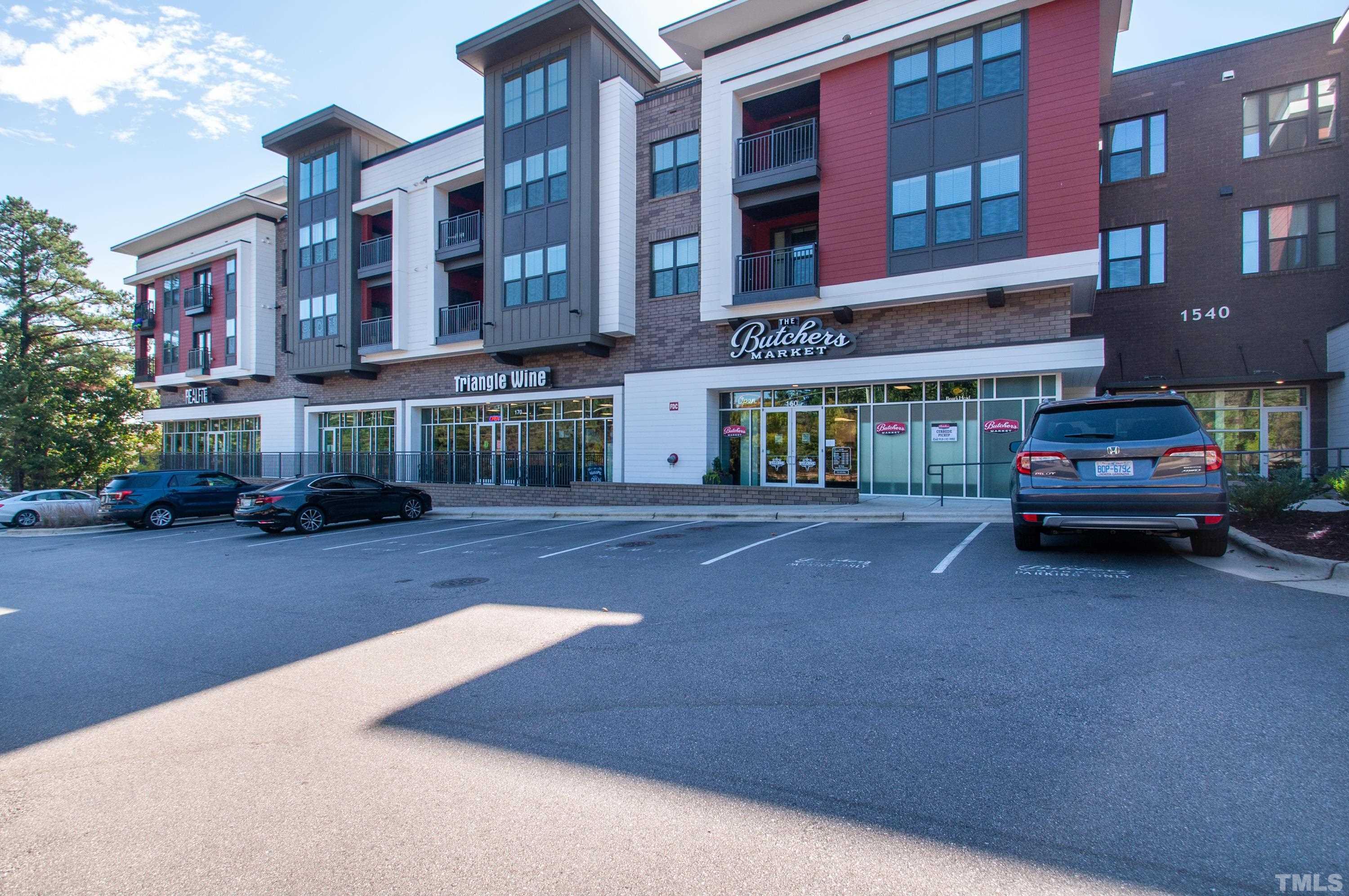 2210 Raven Road, Unit 102 Raleigh, NC 27614 - Photo 26 of 33 a view of a street with cars