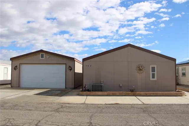 a house with trees in the background