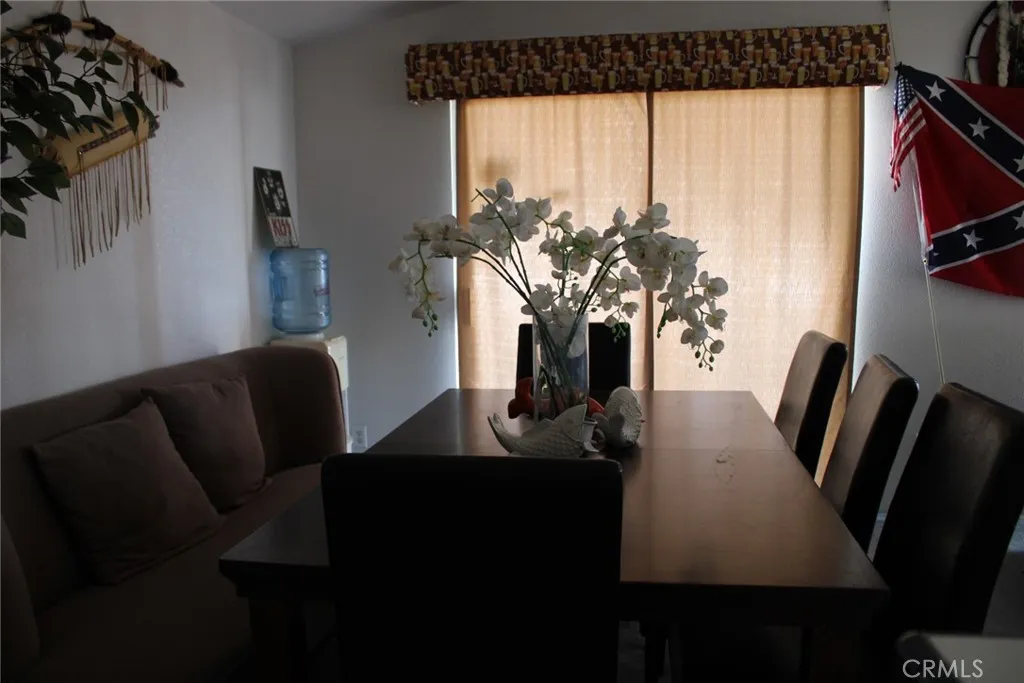 2 Havasu Lake Road Needles, CA 92363 - Photo 24 of 24 a view of a dining room with furniture window and wooden floor