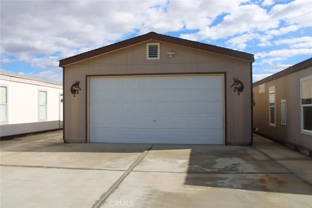 2 Havasu Lake Road Needles, CA 92363 - Photo 6 of 24 a front view of a house with a garage