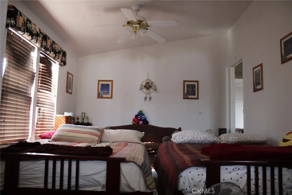 2 Havasu Lake Road Needles, CA 92363 - Photo 10 of 24 a living room with furniture a chandelier and a window