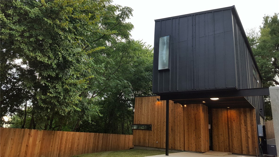 2909 Glen Rae Street, Unit B Austin, TX 78702 - Photo 1 of 1 a view of backyard with wooden fence and trees