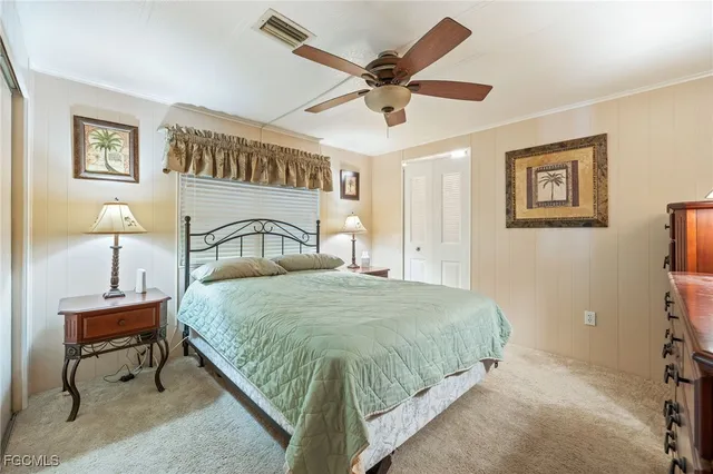 a bedroom with a bed and a table