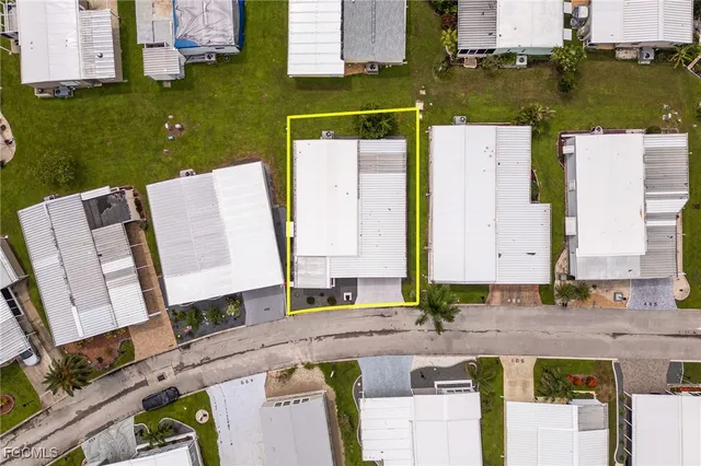 an aerial view of a house with a swimming pool