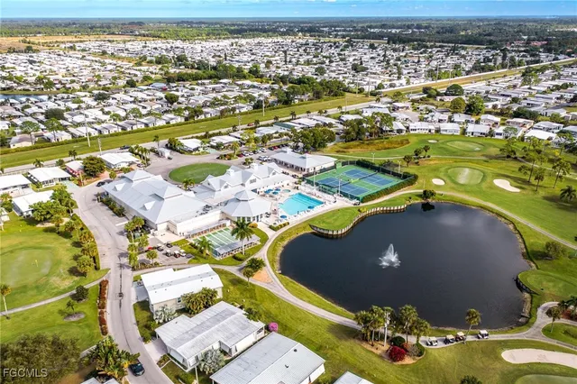 an aerial view of a house with a swimming pool