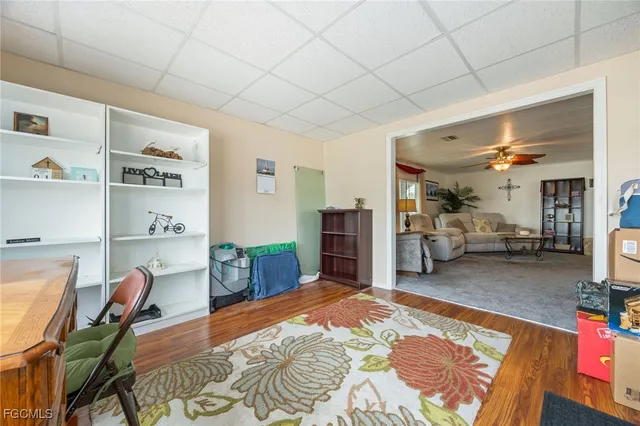 a bedroom with furniture and a wooden floor