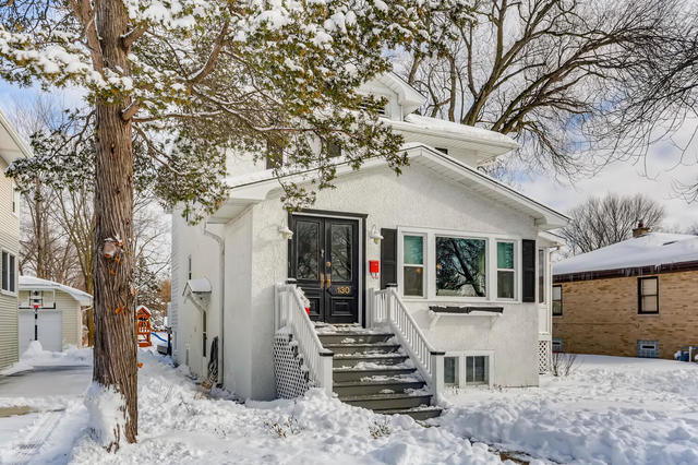 130 Southcote Road Riverside, IL 60546 - Photo 1 of 31 a view of a house with a tree in the background