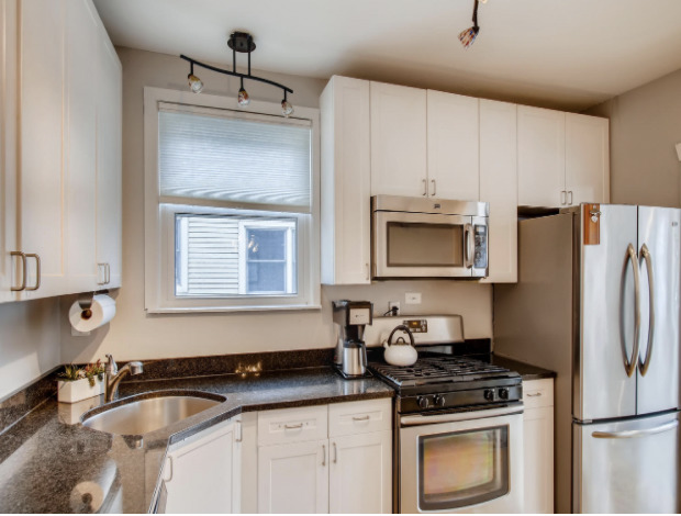 130 Southcote Road Riverside, IL 60546 - Photo 14 of 31 a kitchen with granite countertop a refrigerator stove and sink