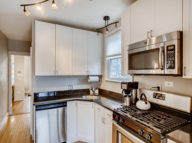 130 Southcote Road Riverside, IL 60546 - Photo 15 of 31 a kitchen with a stove and a microwave