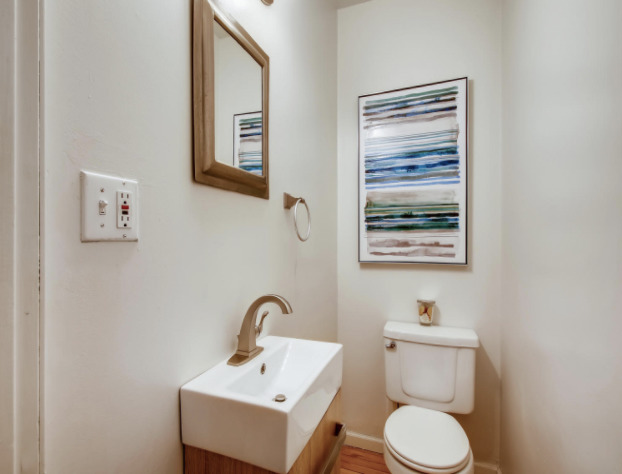 130 Southcote Road Riverside, IL 60546 - Photo 17 of 31 a bathroom with a toilet sink and mirror