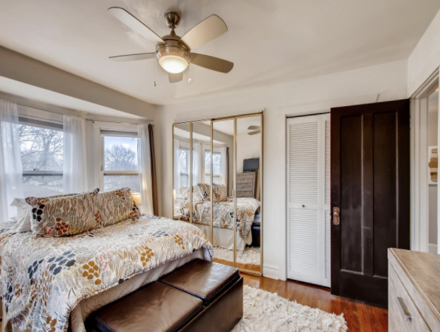 130 Southcote Road Riverside, IL 60546 - Photo 22 of 31 a bedroom with a large bed and a chandelier