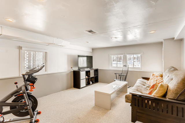 130 Southcote Road Riverside, IL 60546 - Photo 26 of 31 a living room with furniture a window and gym equipment