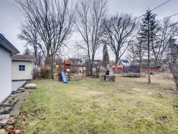 130 Southcote Road Riverside, IL 60546 - Photo 31 of 31 a view of a yard with a house and a tree