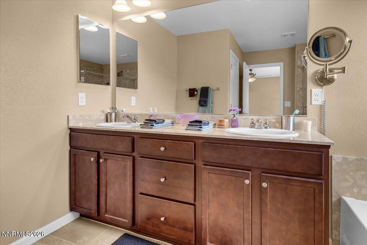 104 Bethpage Road Dayton, NV 89403 - Photo 27 of 65 a bathroom with a sink double vanity and a mirror