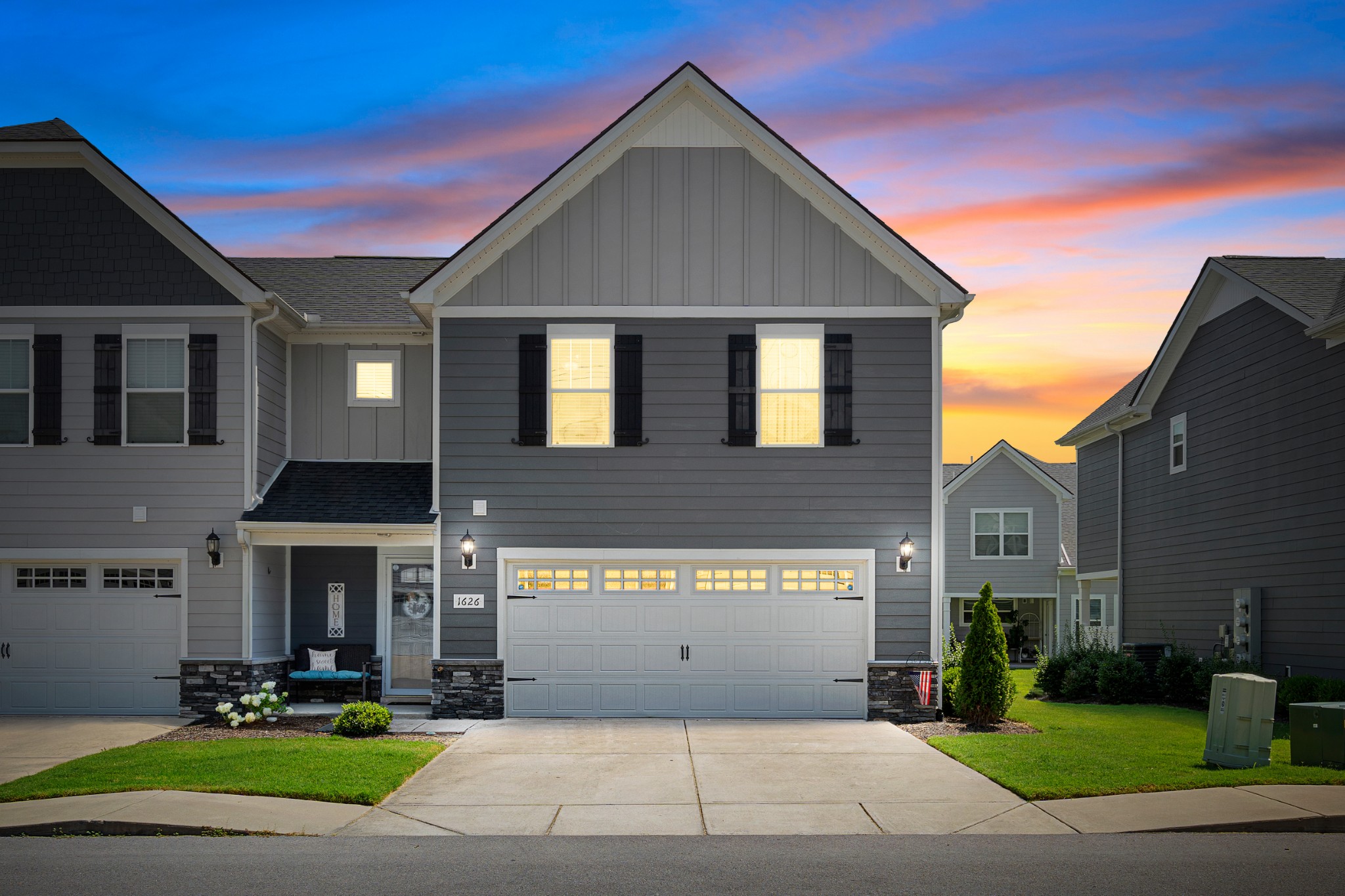 a front view of a house with garden
