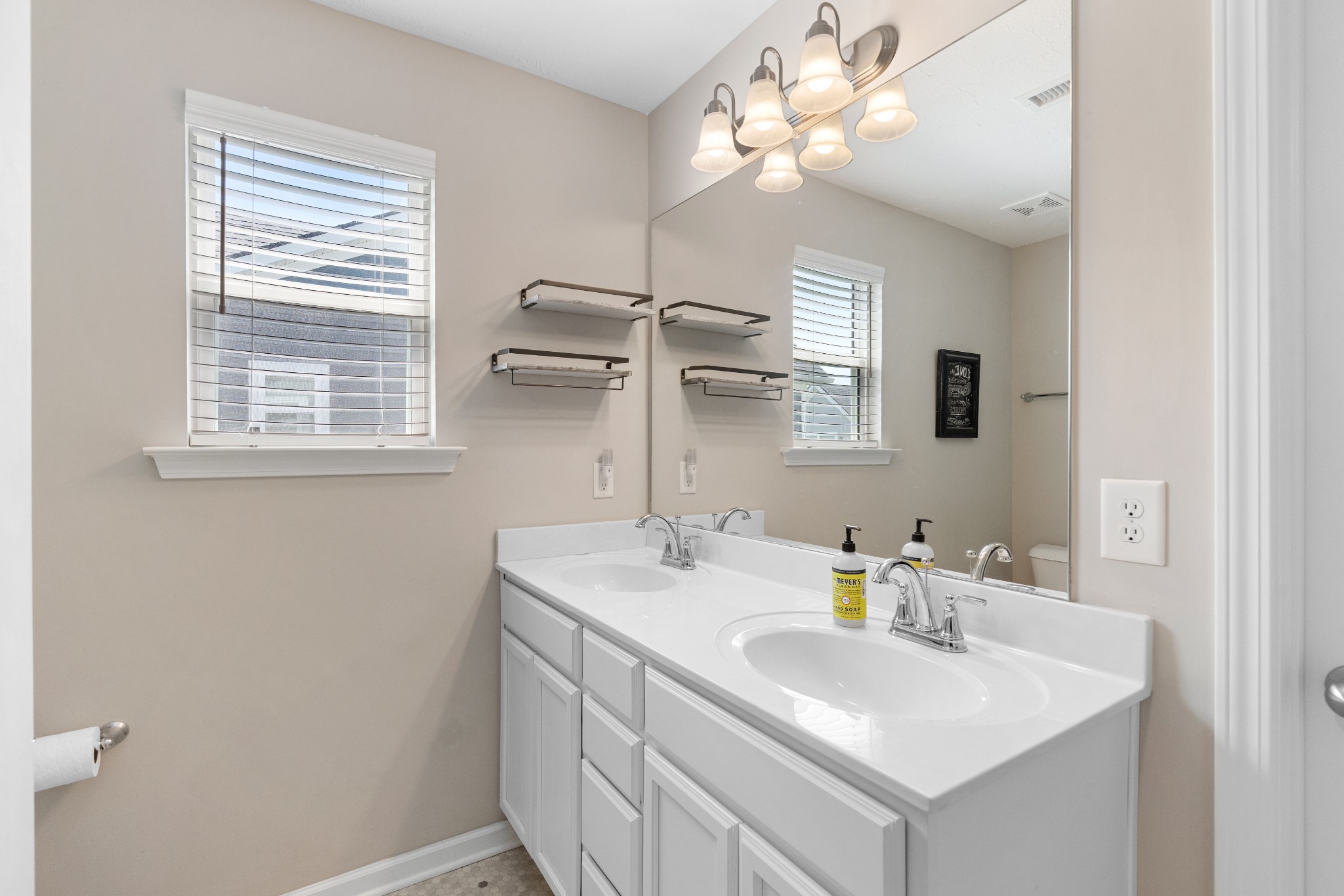 1626 Calcutta Drive Murfreesboro, TN 37128 - Photo 24 of 35 a bathroom with a sink a mirror and a vanity