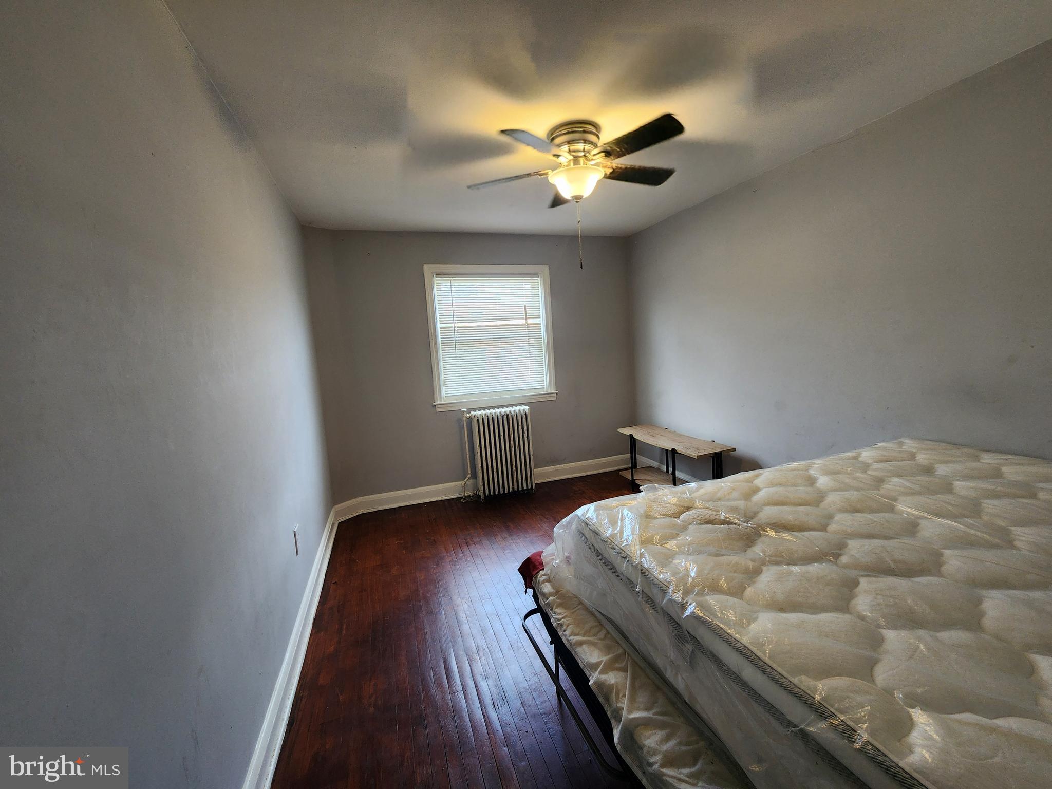 1310 Edison Highway Baltimore, MD 21213 - Photo 16 of 31 a bedroom with bed and window