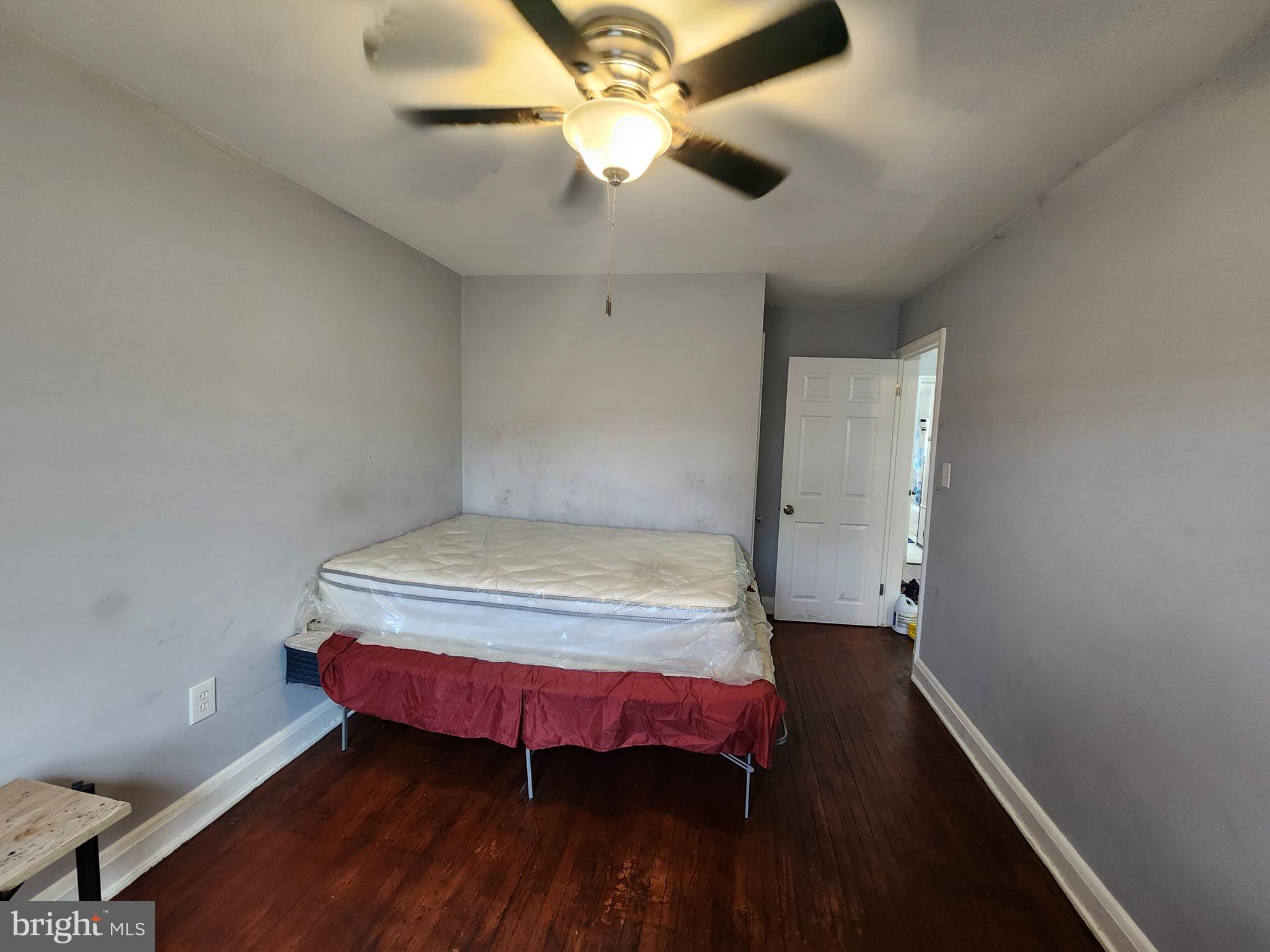 1310 Edison Highway Baltimore, MD 21213 - Photo 17 of 31 a bedroom with a bed and a chandelier