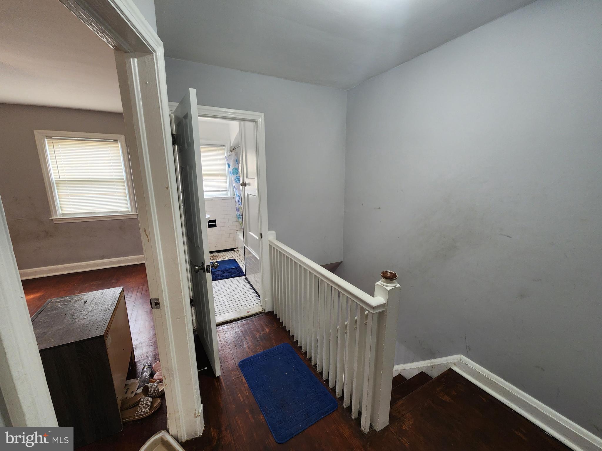 1310 Edison Highway Baltimore, MD 21213 - Photo 18 of 31 a view of a hallway with wooden floor and stairs