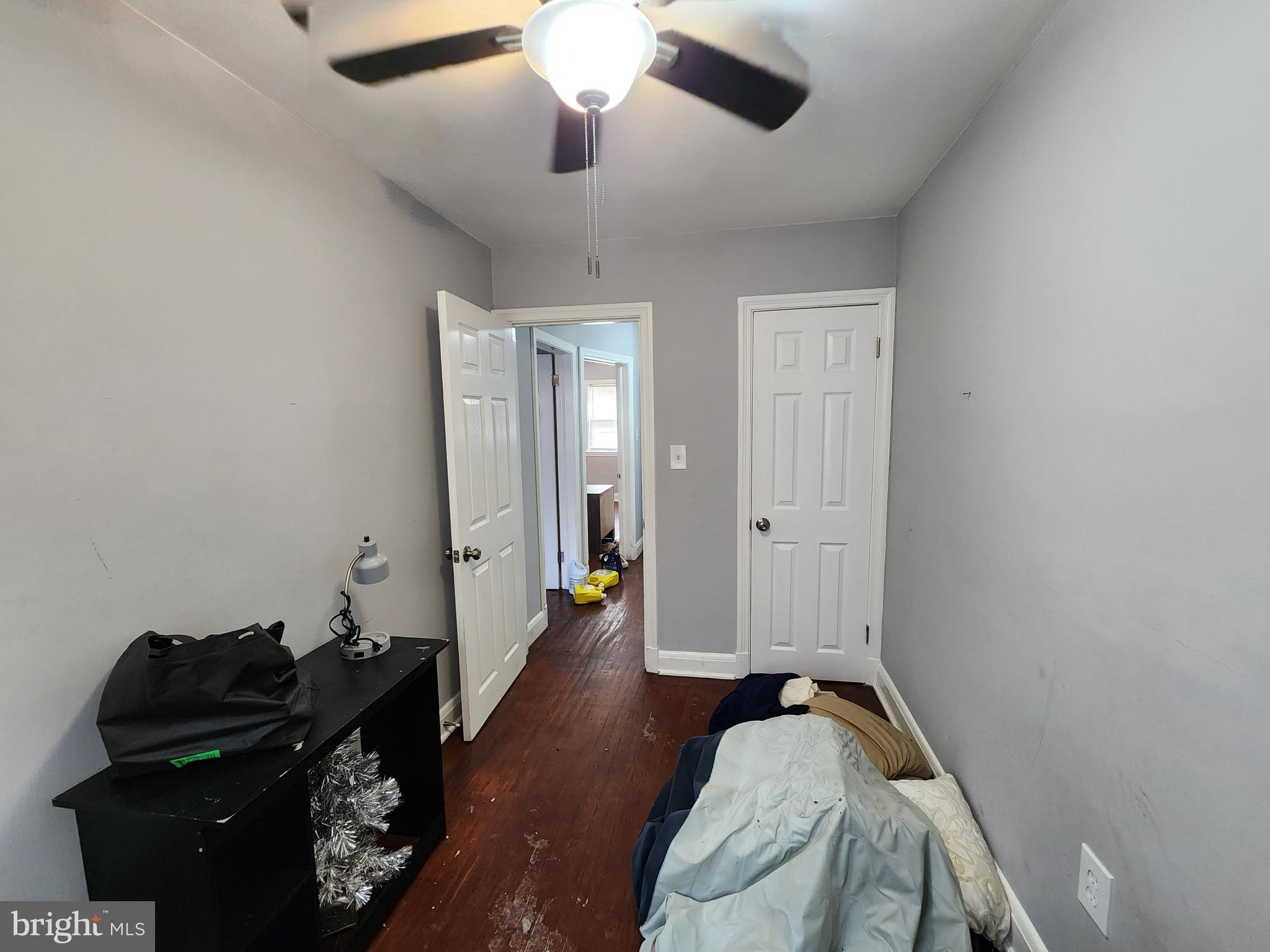 1310 Edison Highway Baltimore, MD 21213 - Photo 20 of 31 a bedroom with a bed and a mirror