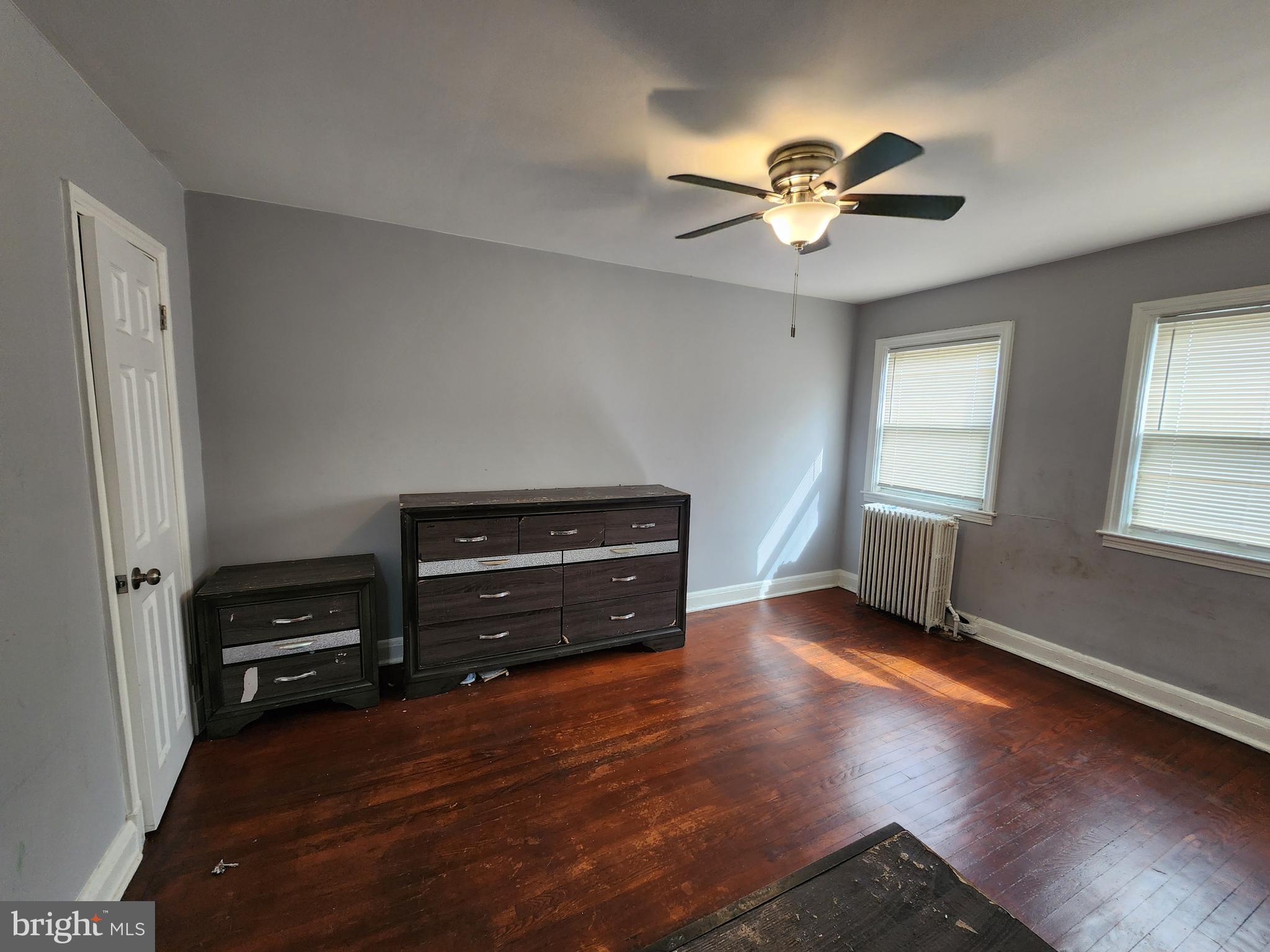 1310 Edison Highway Baltimore, MD 21213 - Photo 22 of 31 a view of livingroom with hardwood floor and a ceiling fan