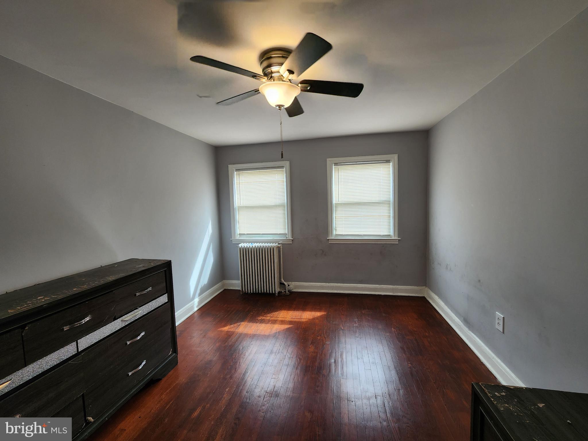 1310 Edison Highway Baltimore, MD 21213 - Photo 23 of 31 a view of an empty room with wooden floor and a window
