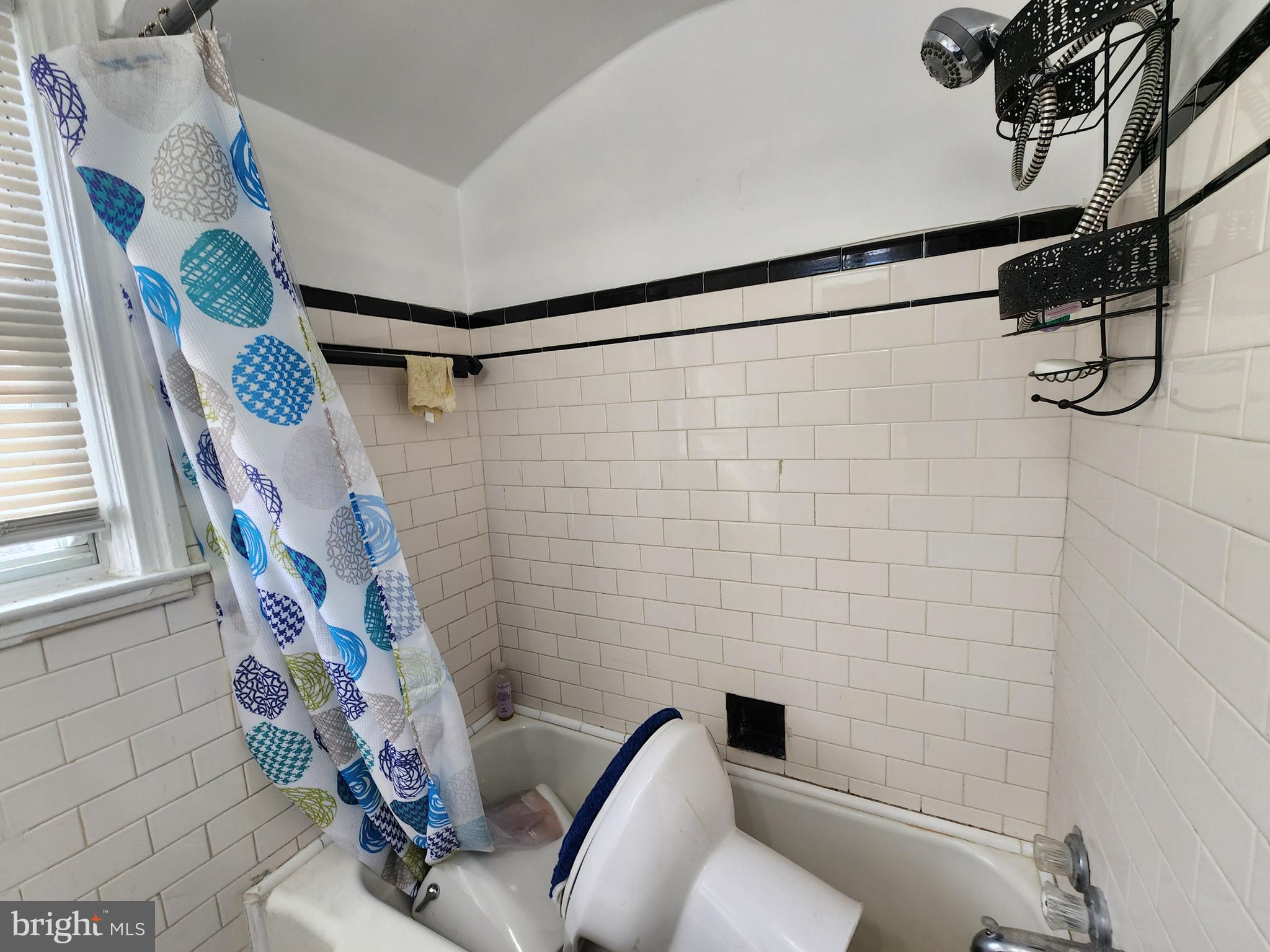 1310 Edison Highway Baltimore, MD 21213 - Photo 27 of 31 a bathroom with a toilet and shower