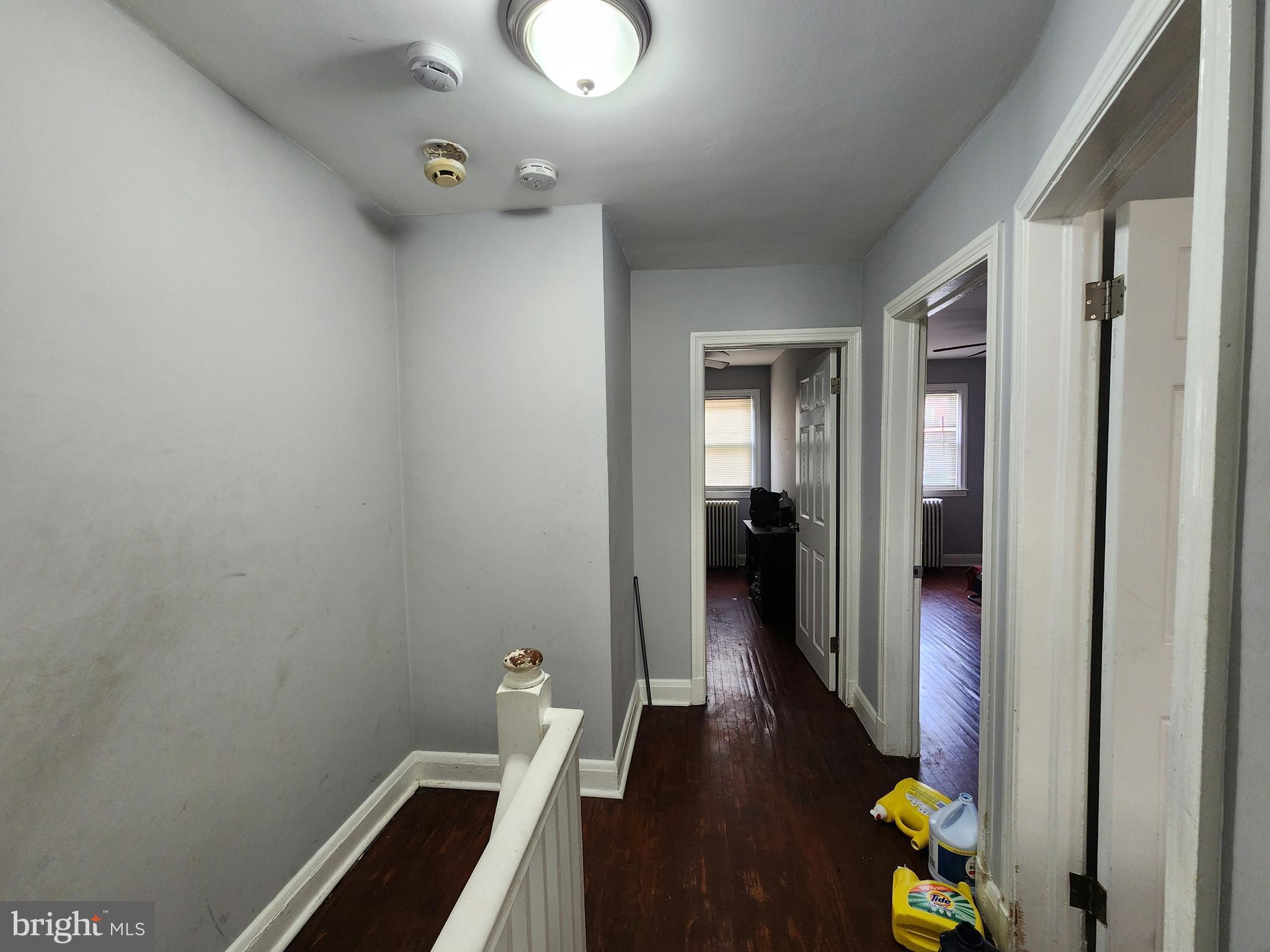 1310 Edison Highway Baltimore, MD 21213 - Photo 28 of 31 a view of a hallway with wooden floor and staircase