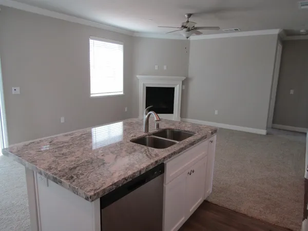 a kitchen with a sink dishwasher and microwave