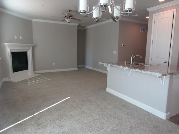 a view of a hallway with a chandelier