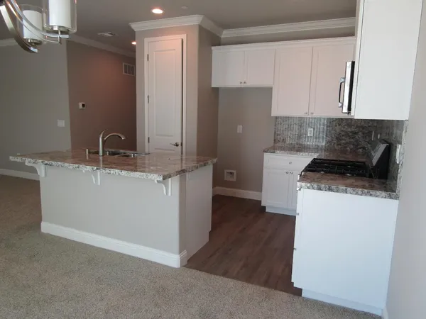 a kitchen with a sink and a refrigerator