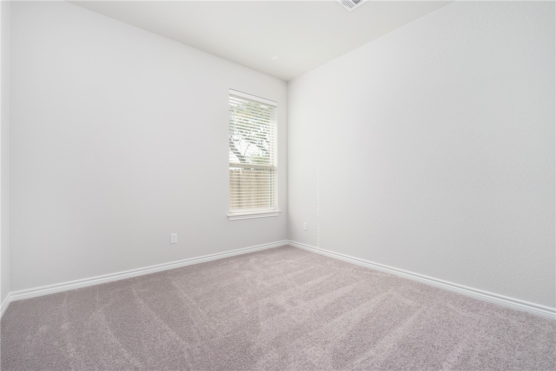 1613 Winding Stream Trail, Unit 75 Leander, TX 78641 - Photo 19 of 23 an empty room with windows