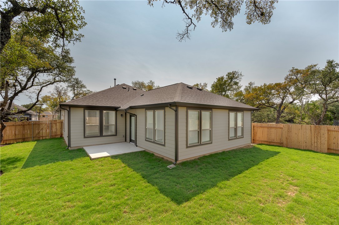 1613 Winding Stream Trail, Unit 75 Leander, TX 78641 - Photo 23 of 23 a view of a house with a yard and a garden