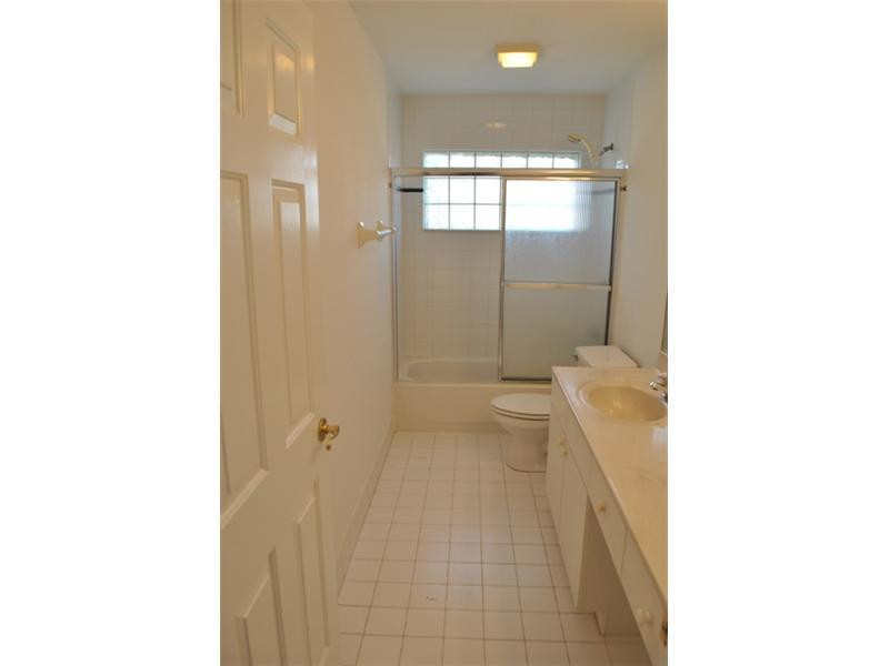 720 Natures Cove Road Dania Beach, FL 33004 - Photo 14 of 17 a bathroom with a toilet and a shower