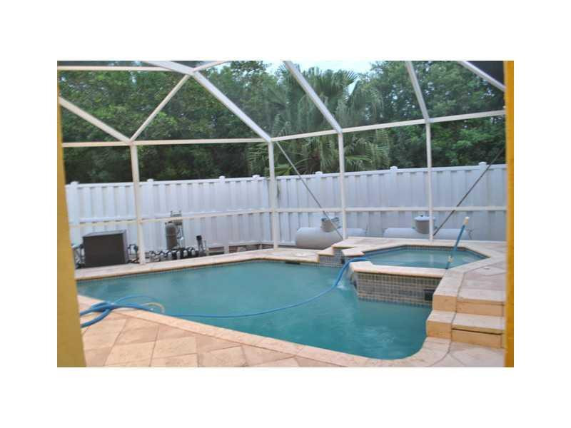 720 Natures Cove Road Dania Beach, FL 33004 - Photo 16 of 17 a bathroom with a sink and bathtub