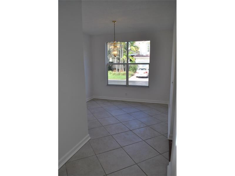720 Natures Cove Road Dania Beach, FL 33004 - Photo 5 of 17 a picture of a room that has a window and a rug