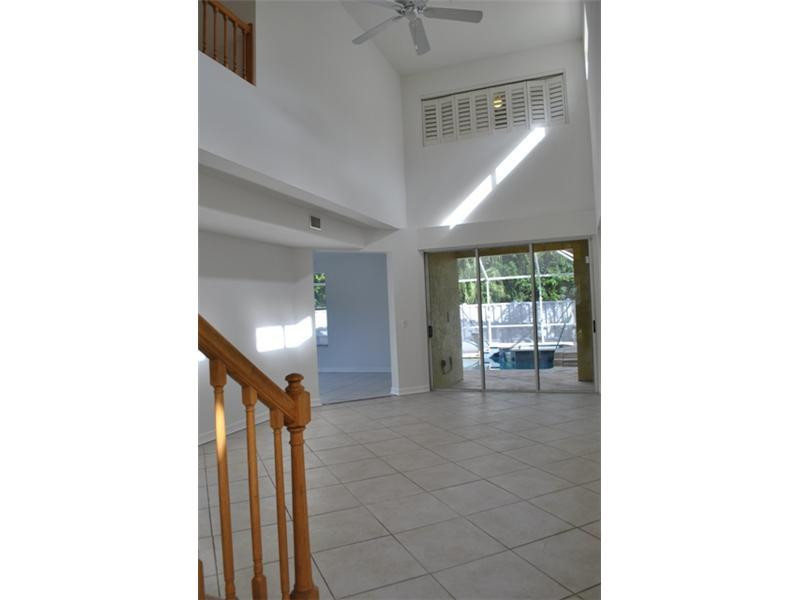 720 Natures Cove Road Dania Beach, FL 33004 - Photo 7 of 17 a view of a hallway with furniture and entryway