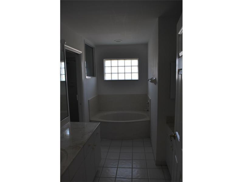 720 Natures Cove Road Dania Beach, FL 33004 - Photo 9 of 17 a bathroom with a toilet and a shower