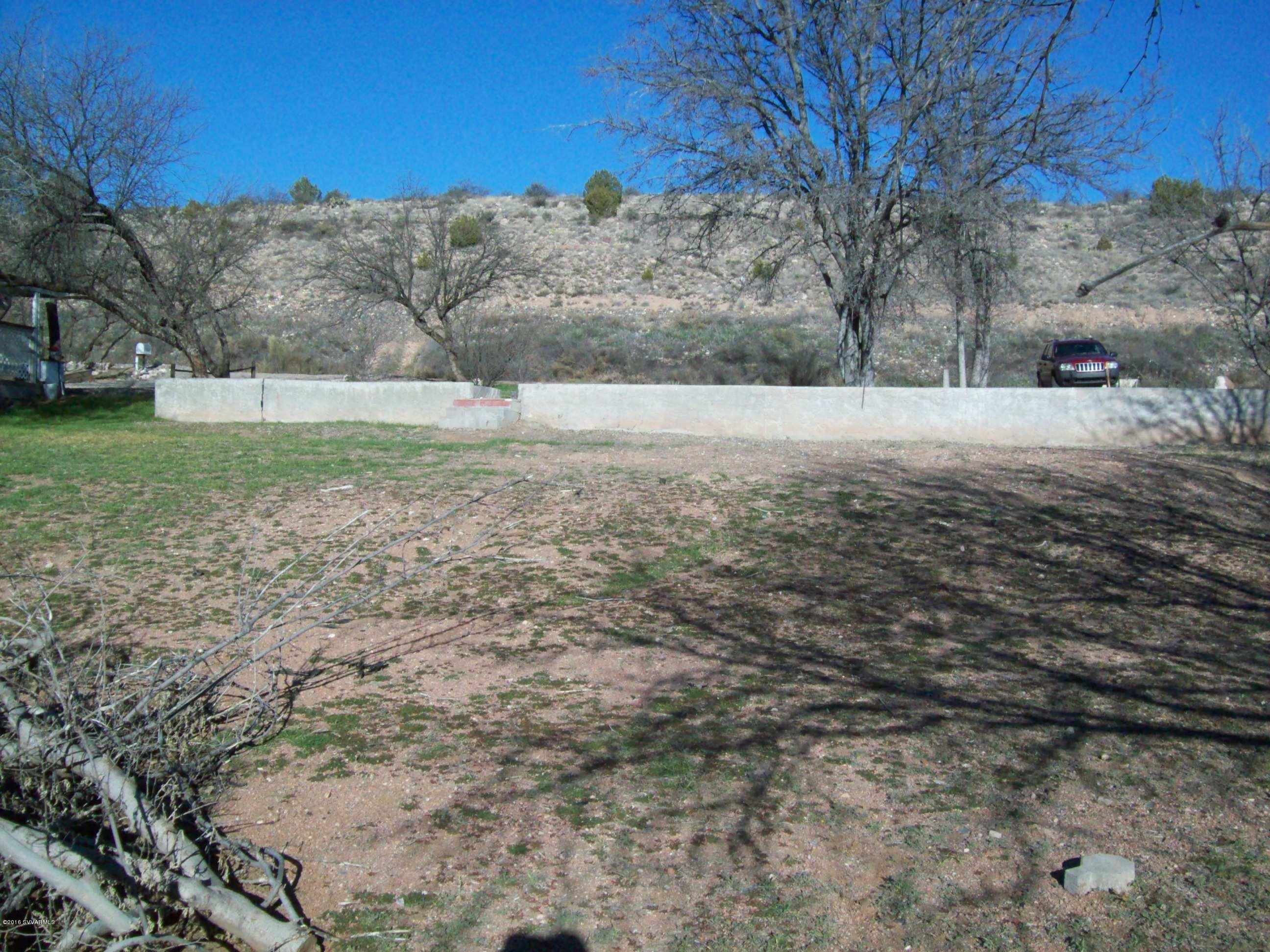4350 East Shade Road Rimrock, AZ 86335 - Photo 1 of 3 a view of dirt yard with a large tree