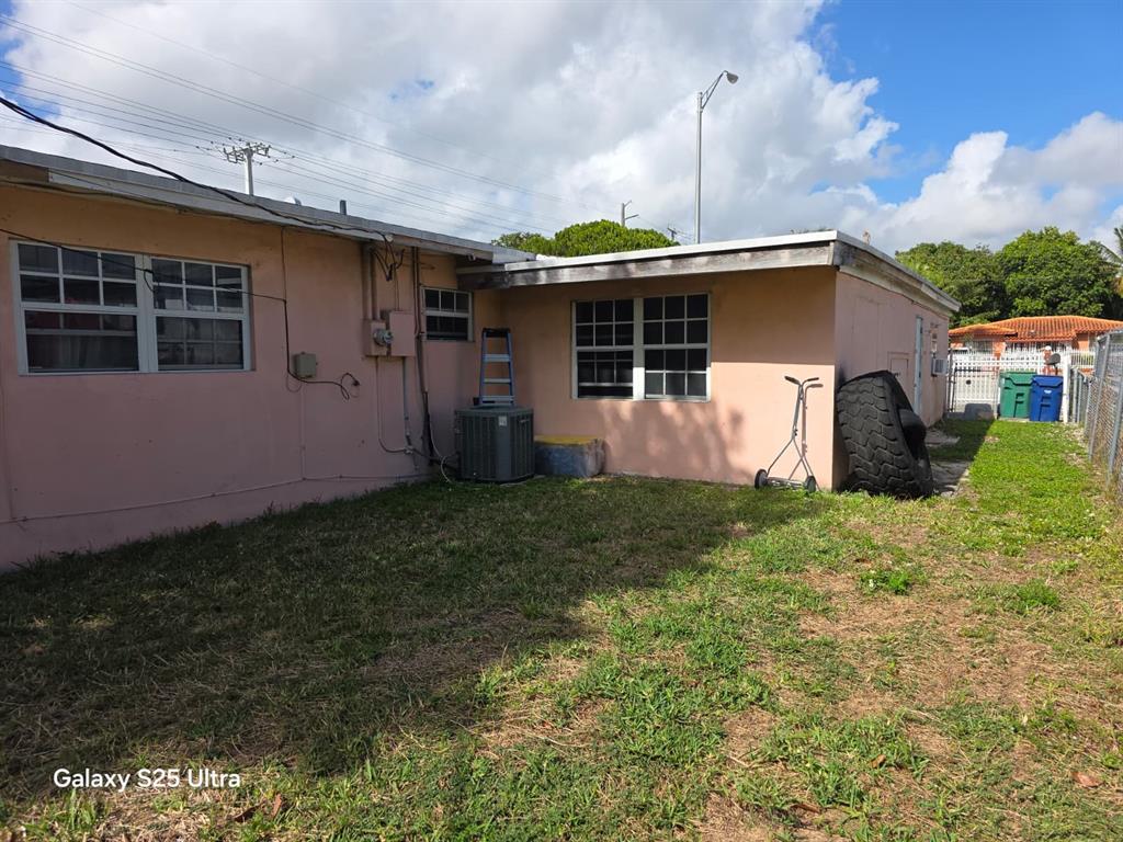 446 Northwest 119th Street Miami, FL 33168 - Photo 14 of 14 a view of a backyard with potted plants