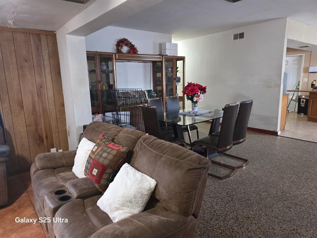 446 Northwest 119th Street Miami, FL 33168 - Photo 2 of 14 a living room with furniture and a wooden floor