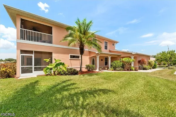 a front view of house with yard and green space
