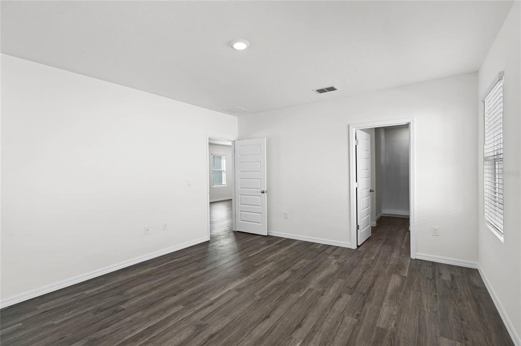 1726 Hummingbird Road Winter Haven, FL 33884 - Photo 13 of 28 a view of a room with wooden floor