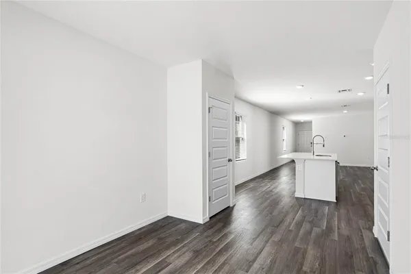 a view of a kitchen with wooden floor