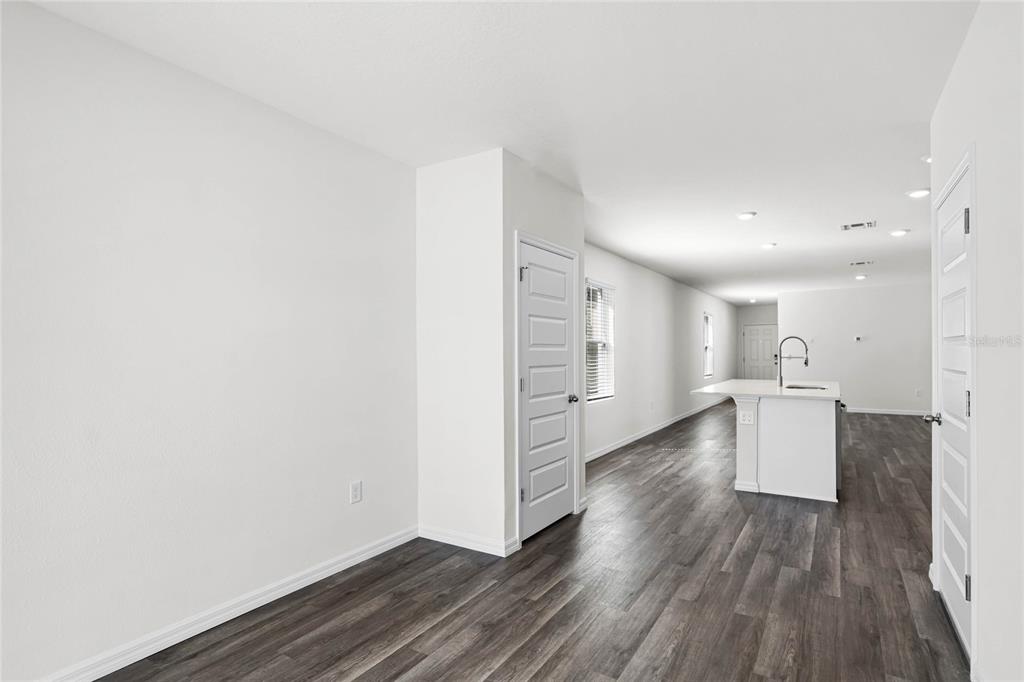 1726 Hummingbird Road Winter Haven, FL 33884 - Photo 10 of 28 a view of a kitchen with wooden floor